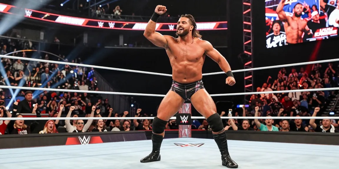 LA Knight showcasing his wrestling prowess in the WWE ring, surrounded by cheering fans.